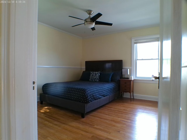 15553 Mclain Ave, Allen Park, MI 48101 - bedroom featuring wood finished floors, ornamental molding, and a ceiling fan