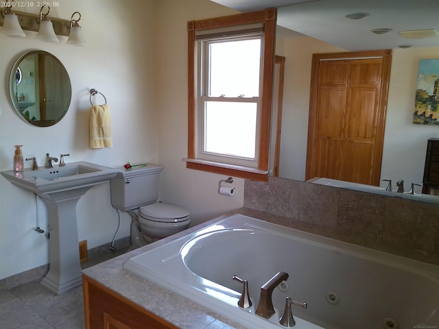 15553 Mclain Ave, Allen Park, MI 48101 - bathroom featuring a whirlpool tub and tile patterned flooring