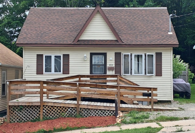 309 Fir St, Munising, MI 49862 - view of front of home with roof with shingles and a wooden deck