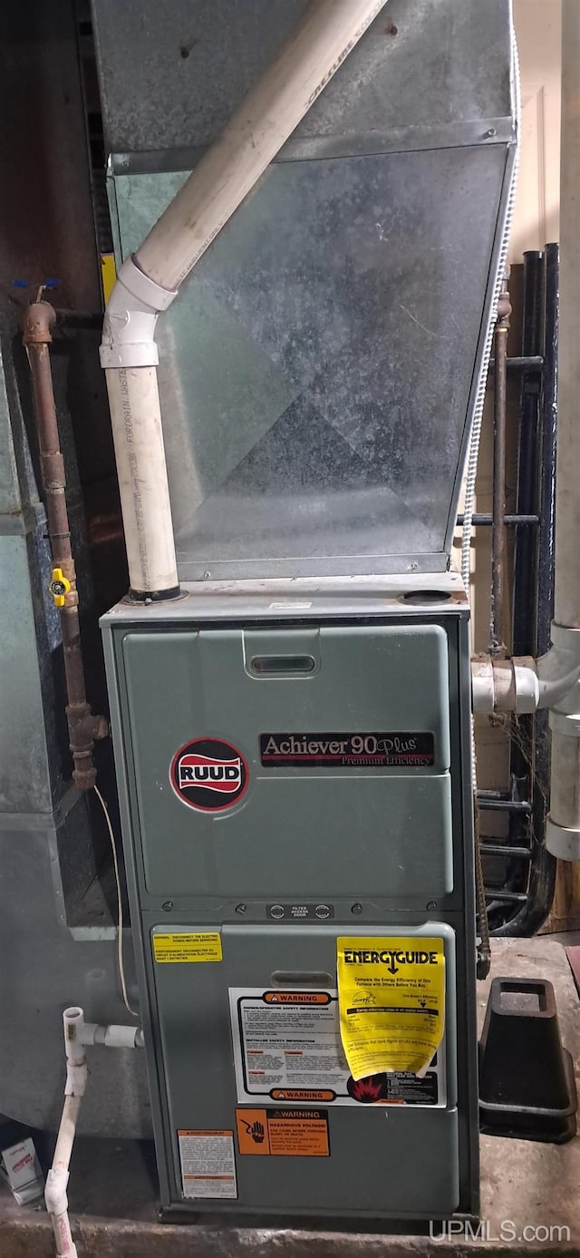 309 Fir St, Munising, MI 49862 - utility room featuring heating unit