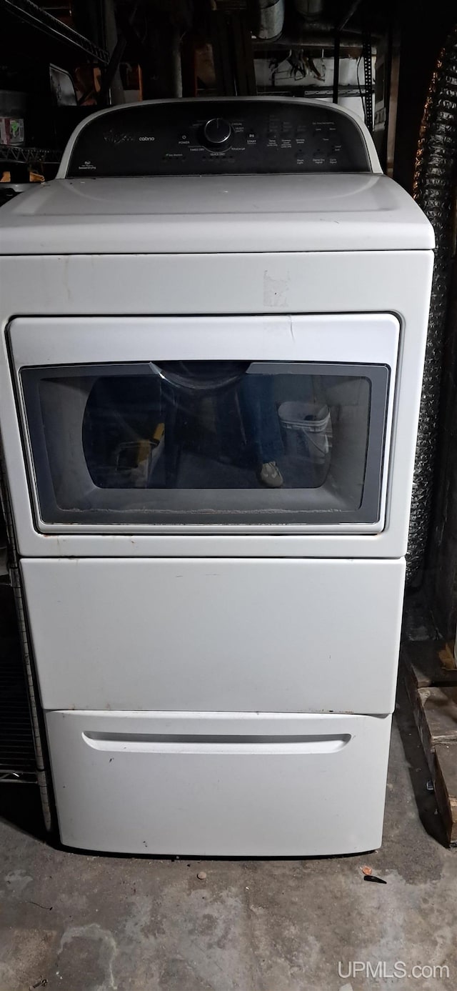 309 Fir St, Munising, MI 49862 - detailed view of washer / dryer and unfinished concrete flooring
