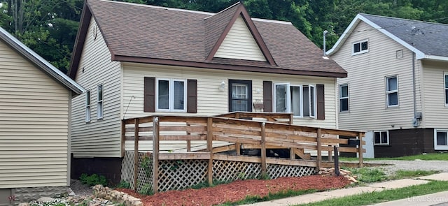 309 Fir St, Munising, MI 49862 - view of front of home featuring a shingled roof and a deck