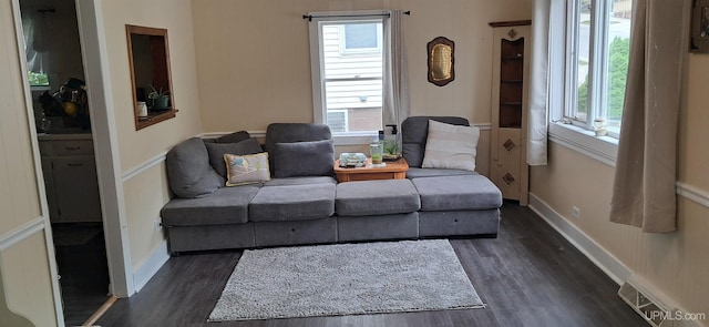 309 Fir St, Munising, MI 49862 - living room featuring dark wood-type flooring and baseboards