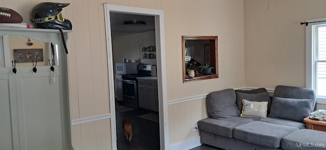 309 Fir St, Munising, MI 49862 - living area featuring healthy amount of natural light and a decorative wall