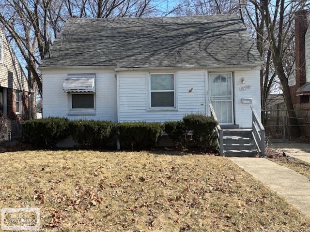 10530 Lakepointe St, Detroit, MI 48224 - view of front of home with roof with shingles and a front yard