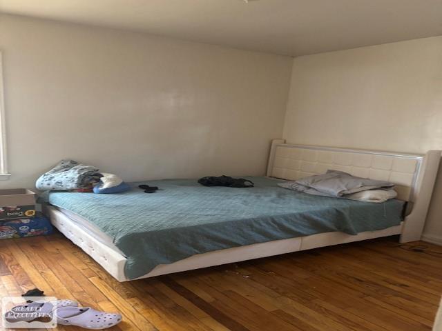 10530 Lakepointe St, Detroit, MI 48224 - bedroom with wood-type flooring