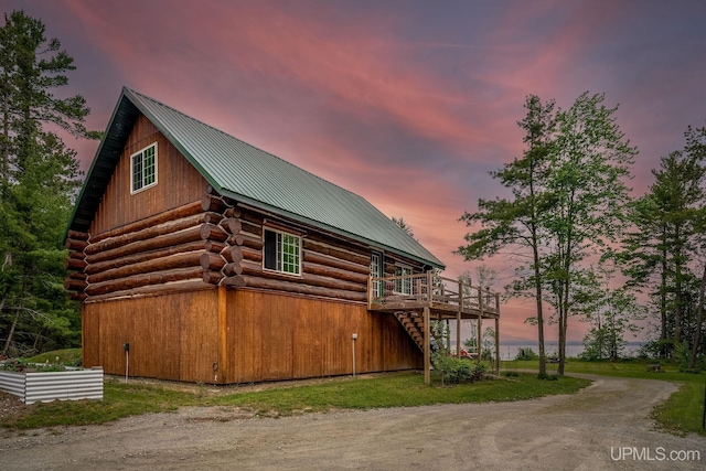 14038 24.5 Ln, Rapid River, MI 49878 - view of property exterior with log exterior, a metal roof, a deck, and stairs