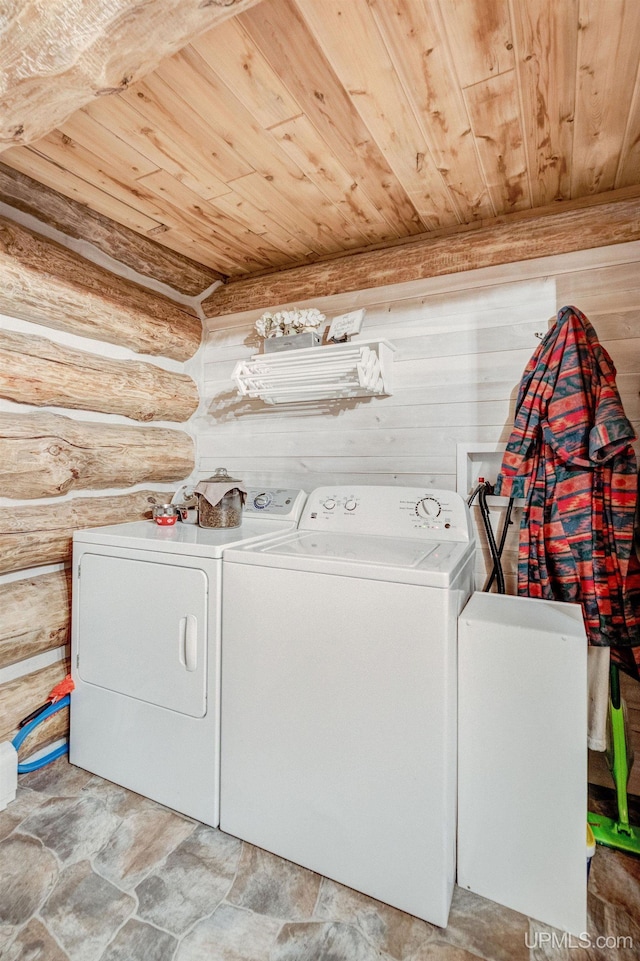 14038 24.5 Ln, Rapid River, MI 49878 - laundry area with independent washer and dryer, wood ceiling, light stone finish floors, and log walls