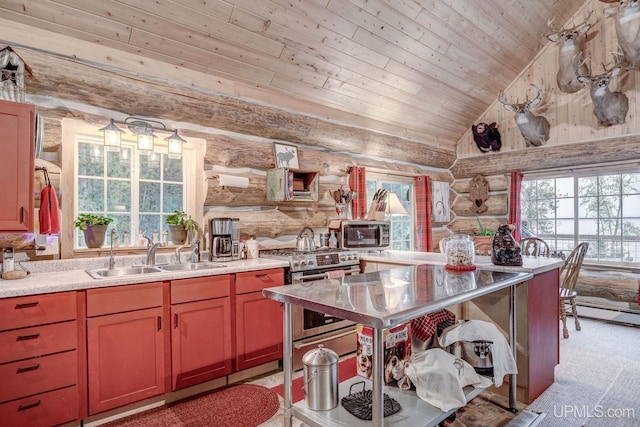 14038 24.5 Ln, Rapid River, MI 49878 - kitchen featuring rustic walls, stainless steel appliances, vaulted ceiling, wood ceiling, and light countertops