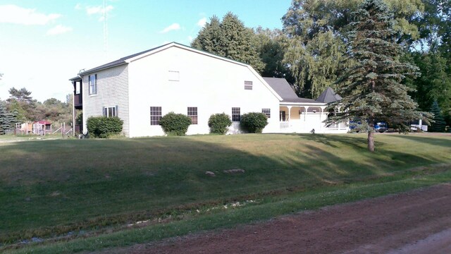 2849 Shaffer Rd, Beaverton, MI 48612 - view of side of home with a lawn
