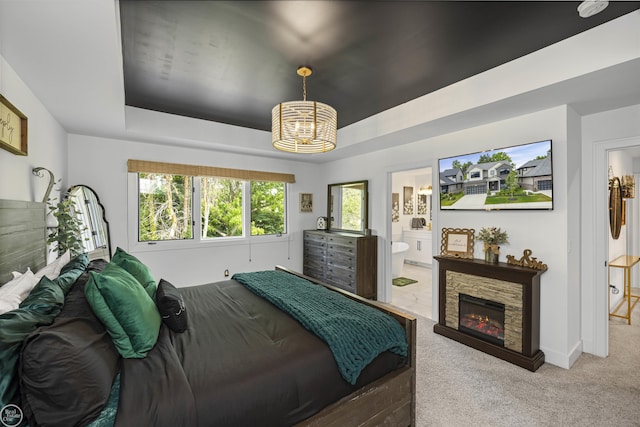 54877 Camden Ct, Shelby Twp, MI 48316 - bedroom featuring a chandelier, carpet floors, a raised ceiling, connected bathroom, and a fireplace
