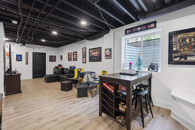 54877 Camden Ct, Shelby Twp, MI 48316 - bar area featuring wood finished floors and baseboards