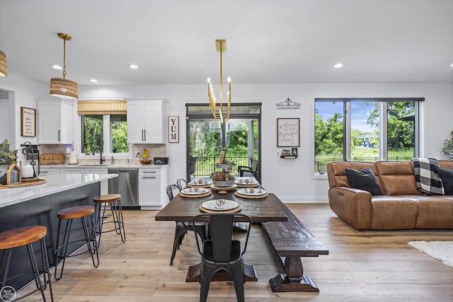 54877 Camden Ct, Shelby Twp, MI 48316 - dining space with light wood-type flooring and recessed lighting