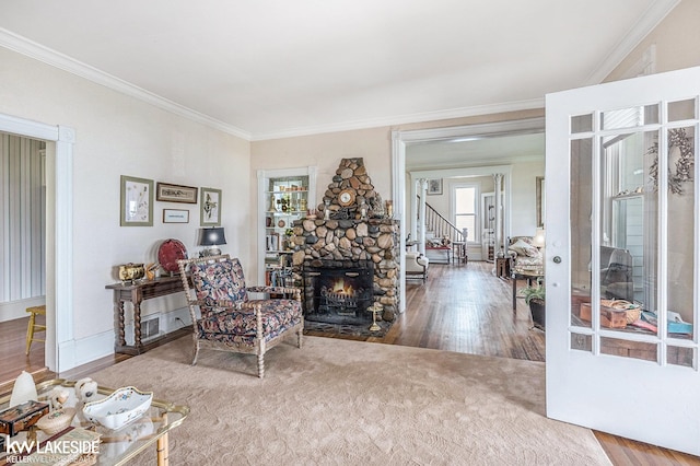 1520 S Channel Dr, Harsens Island, MI 48028 - living room with ornamental molding, a fireplace, and wood finished floors