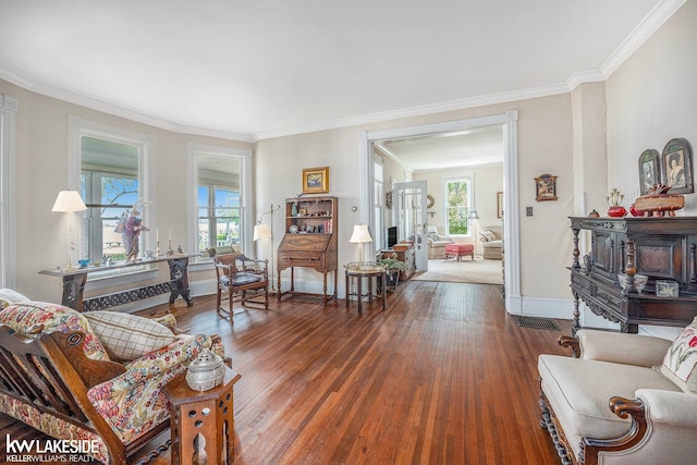 1520 S Channel Dr, Harsens Island, MI 48028 - living room with healthy amount of natural light, wood finished floors, and ornamental molding