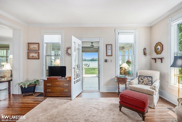 1520 S Channel Dr, Harsens Island, MI 48028 - living area featuring wood finished floors and crown molding