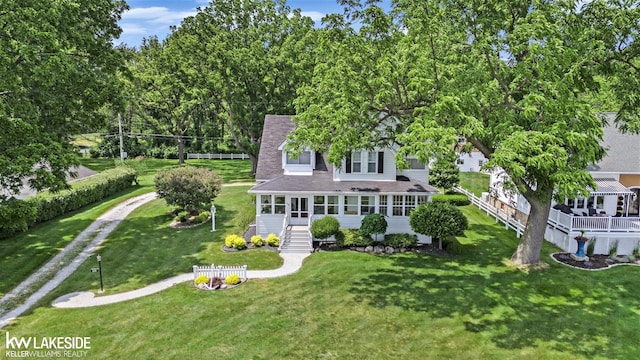 1520 S Channel Dr, Harsens Island, MI 48028 - view of front facade with a front yard and a shingled roof