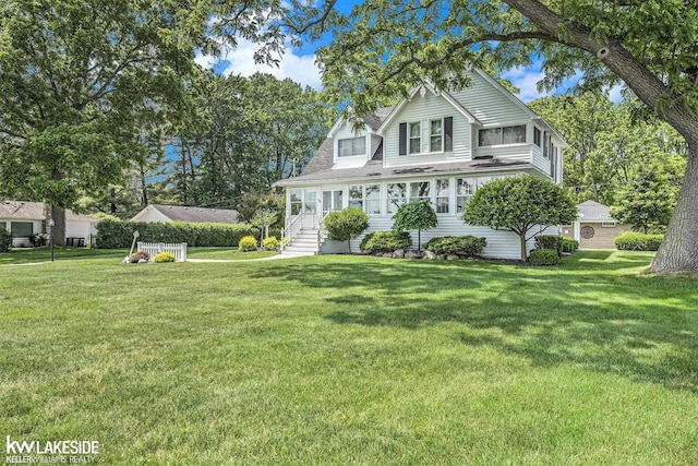 1520 S Channel Dr, Harsens Island, MI 48028 - view of front of house with a front yard