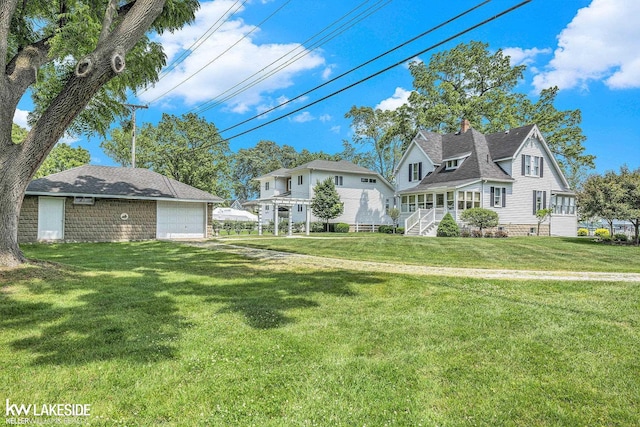 1520 S Channel Dr, Harsens Island, MI 48028 - view of grassy yard featuring a detached garage