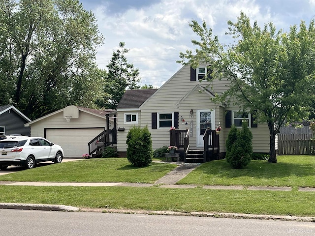754 Duncan Ave, Ishpeming, MI 49849 - new england style home featuring a front lawn and a shingled roof