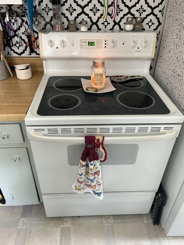 754 Duncan Ave, Ishpeming, MI 49849 - kitchen with white electric stove and light countertops