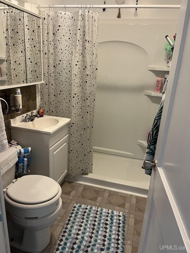 754 Duncan Ave, Ishpeming, MI 49849 - bathroom featuring vanity, a shower with shower curtain, and tile patterned flooring