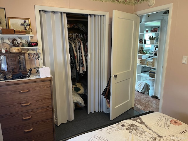 754 Duncan Ave, Ishpeming, MI 49849 - bedroom with a closet and dark carpet