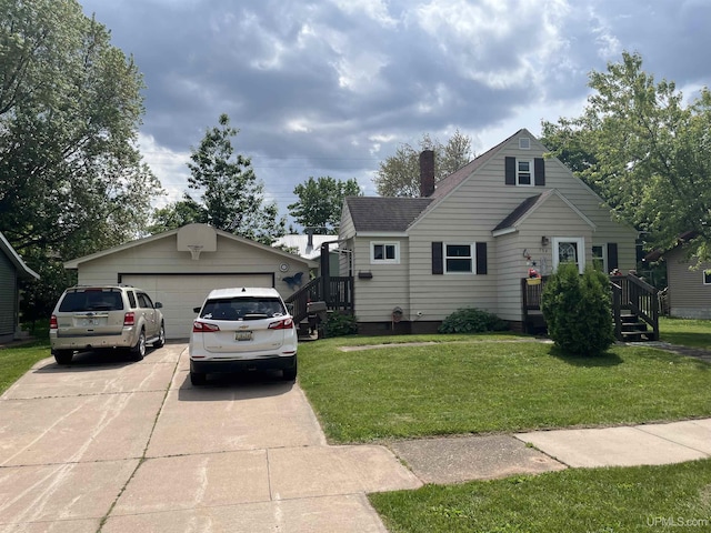 754 Duncan Ave, Ishpeming, MI 49849 - view of front of house with a front yard, an outdoor structure, roof with shingles, and a chimney