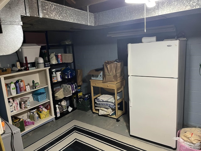 754 Duncan Ave, Ishpeming, MI 49849 - finished basement featuring freestanding refrigerator and concrete block wall