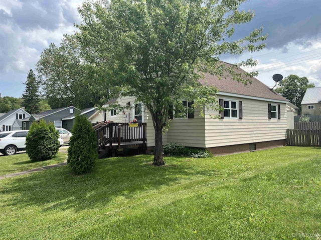 754 Duncan Ave, Ishpeming, MI 49849 - view of property exterior with a shingled roof and a wooden deck