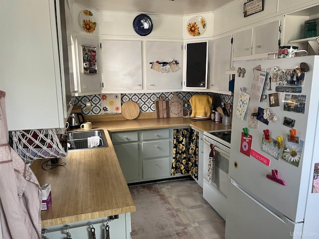 754 Duncan Ave, Ishpeming, MI 49849 - kitchen featuring white appliances, backsplash, light countertops, and white cabinets