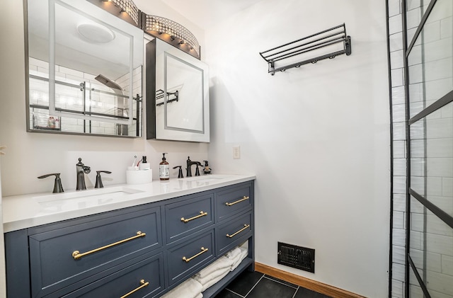 6242 N Geneva Rd, Coleman, MI 48618 - bathroom featuring double vanity, tiled shower, and tile patterned floors