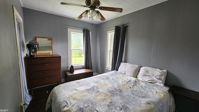 4467 Kings Corner Rd, Glennie, MI 48737 - bedroom featuring ceiling fan and wood finished floors