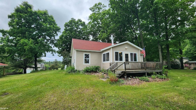 4467 Kings Corner Rd, Glennie, MI 48737 - back of property with a wooden deck and a yard