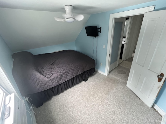 206 Cherry St, Munising, MI 49862 - bedroom with light carpet and vaulted ceiling