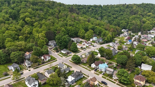 206 Cherry St, Munising, MI 49862 - aerial view of property and surrounding area featuring a heavily wooded area and nearby suburban area