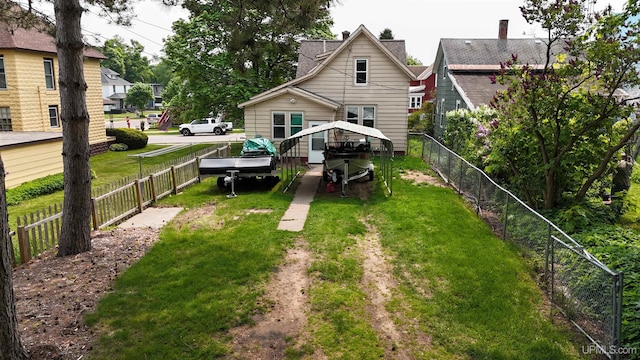 206 Cherry St, Munising, MI 49862 - back of house with a fenced backyard