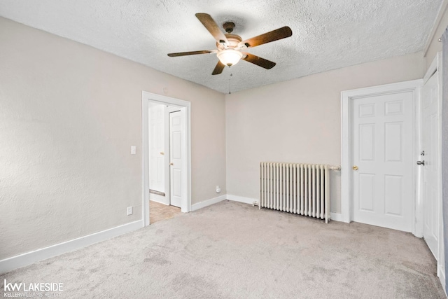 3620 Campbell St, Dearborn, MI 48124 - spare room featuring radiator, ceiling fan, carpet, and a textured ceiling