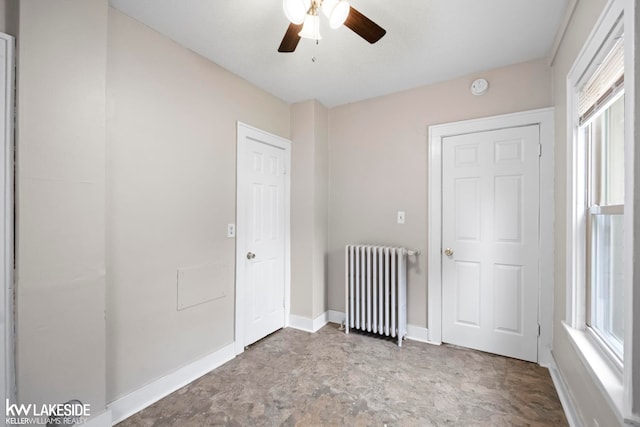 3620 Campbell St, Dearborn, MI 48124 - unfurnished bedroom featuring radiator, multiple windows, and ceiling fan