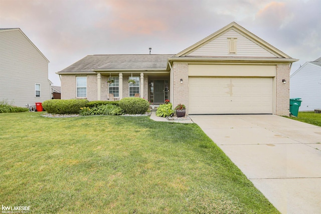56798 Winding Creek Dr, Macomb, MI 48042 - single story home with brick siding, a front yard, a garage, and driveway