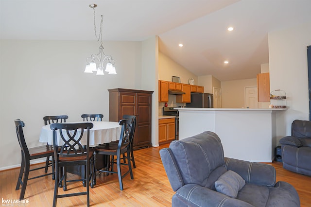 56798 Winding Creek Dr, Macomb, MI 48042 - dining space featuring a chandelier, vaulted ceiling, light wood finished floors, and recessed lighting