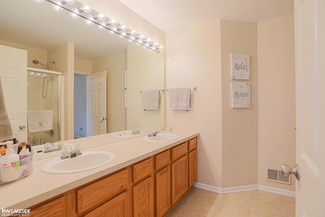 56798 Winding Creek Dr, Macomb, MI 48042 - bathroom featuring double vanity, tile patterned floors, and a shower