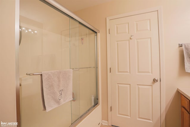 56798 Winding Creek Dr, Macomb, MI 48042 - bathroom with vanity and enclosed tub / shower combo