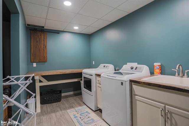56798 Winding Creek Dr, Macomb, MI 48042 - washroom with washing machine and clothes dryer and cabinet space