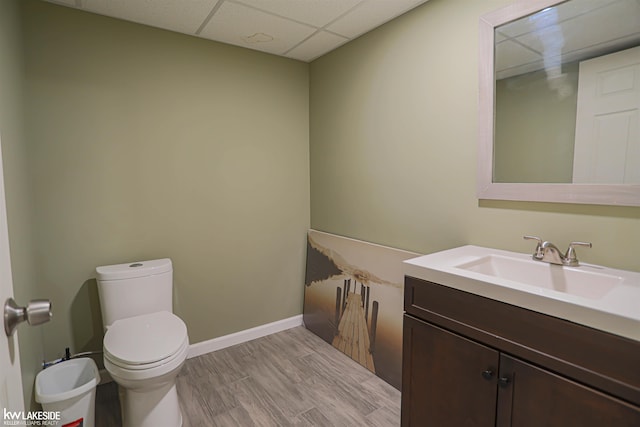 56798 Winding Creek Dr, Macomb, MI 48042 - half bath with a paneled ceiling, vanity, and wood finished floors