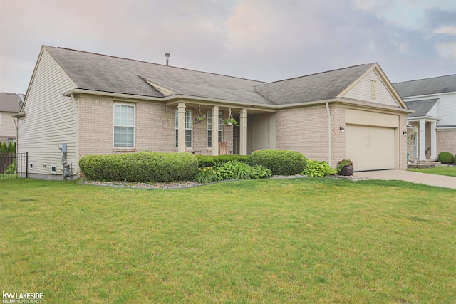 56798 Winding Creek Dr, Macomb, MI 48042 - view of front of property featuring brick siding, an attached garage, driveway, and roof with shingles