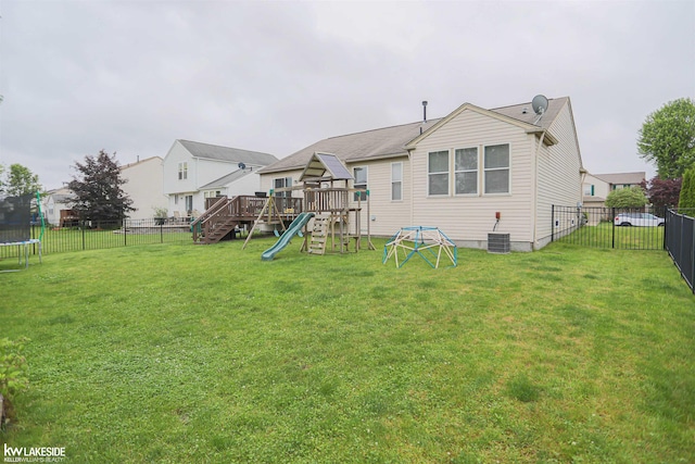 56798 Winding Creek Dr, Macomb, MI 48042 - rear view of property featuring a playground, a trampoline, and a fenced backyard