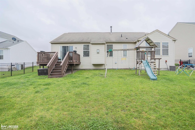 56798 Winding Creek Dr, Macomb, MI 48042 - back of property with a playground, a wooden deck, and stairway