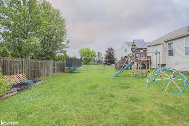 56798 Winding Creek Dr, Macomb, MI 48042 - fenced backyard featuring a trampoline and a playground