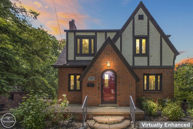 35727 Elm St, Wayne, MI 48184 - english style home with brick siding, a chimney, and stucco siding